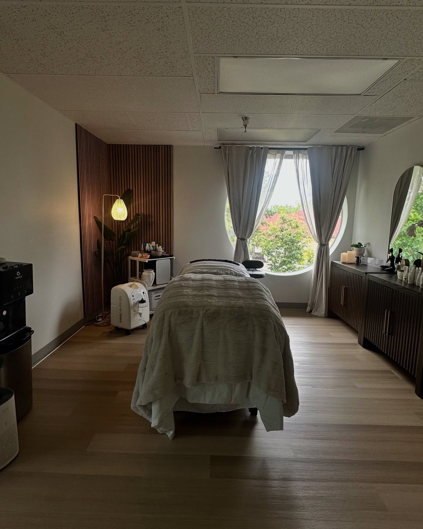 Clean, professional medical spa treatment room with neutral tones at Ora Face Spa in Beaverton